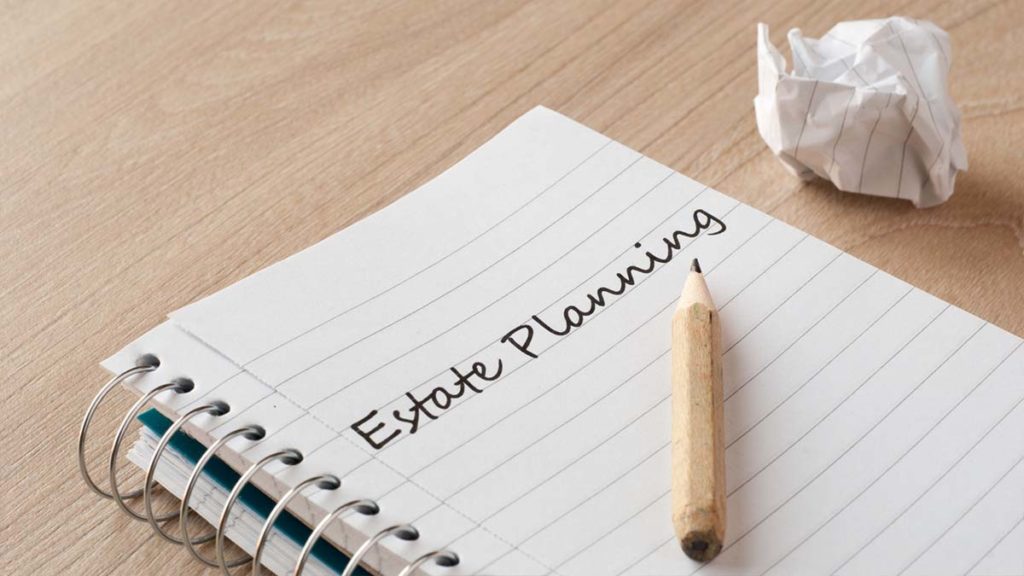 notebook with estate planning mistakes to avoid